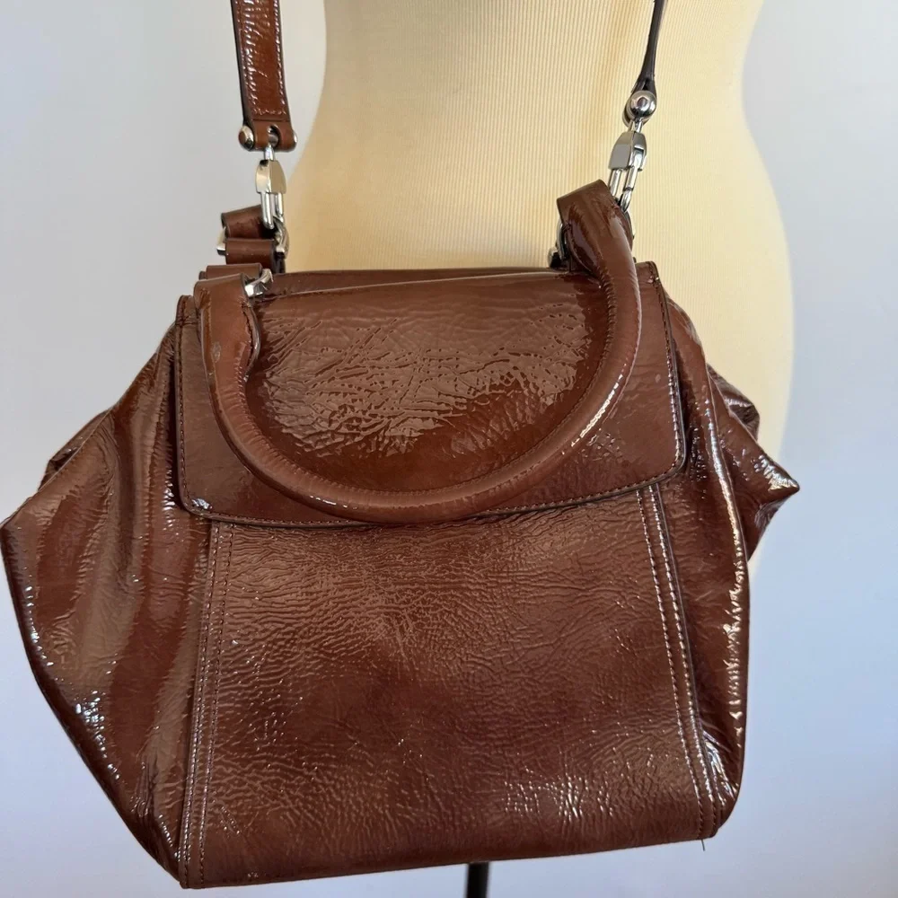 Tory Burch half moon patent leather brown purse with crossbody strap